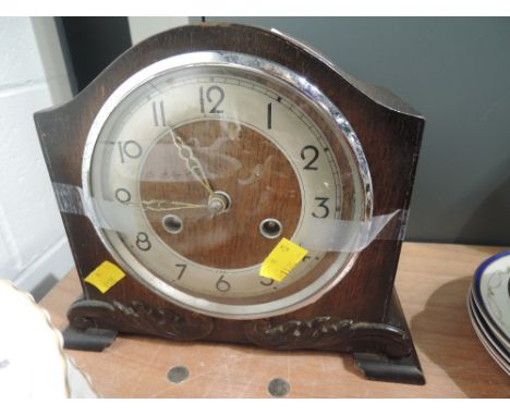 A vintage mantle clock 8 day with oak case