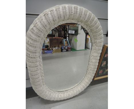 A vintage wicker woven mirror
