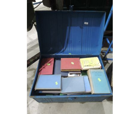 A tin trunk of vintage books