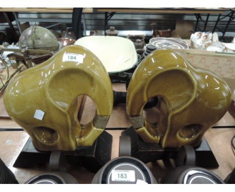 Two vintage green glaze ceramic elephants 