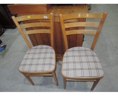 A pair of vintage beech kitchen chairs