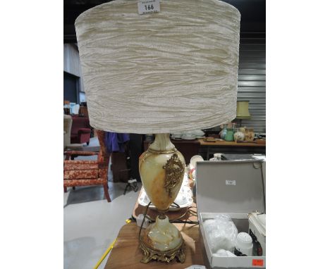 A vintage onyx base and brass style lamp
