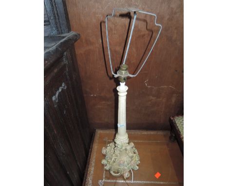 A vintage table lamp having figural base