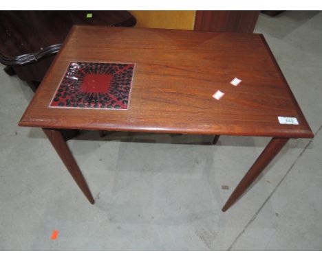 A vintage teak coffee table with tile inset decoration