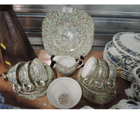 A vintage part tea service by Imperial with gold decoration