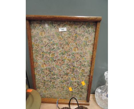 A vintage oak tray with floral print