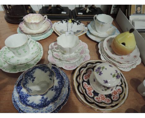A selection of vintage tea cups and saucers including early Shelley triptych, Foley china etc