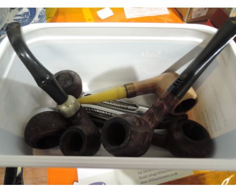 A selection of vintage tobacco smokers pipes including HM silver