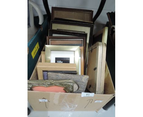 A selection of vintage photo and picture frames