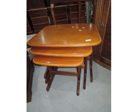 A vintage stylised nest of three tables
