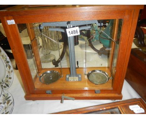 A cased set of Philip Harris Ltd., balance beam apothecary scales