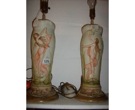 A pair of ceramic lamp bases in the style of Royal Dux decorated with semi nude figures, 43cm tall
Fair to good condition
Min