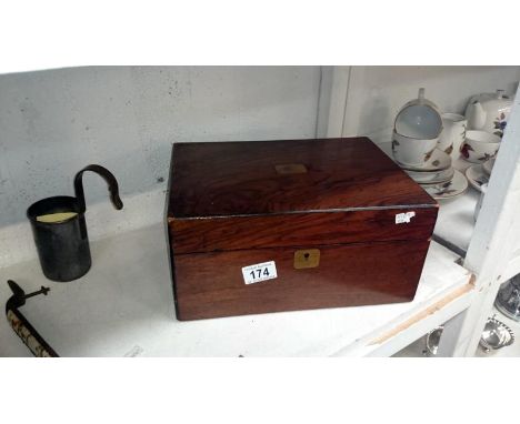 A rosewood veneered box with brass insets containing packs of playing cards