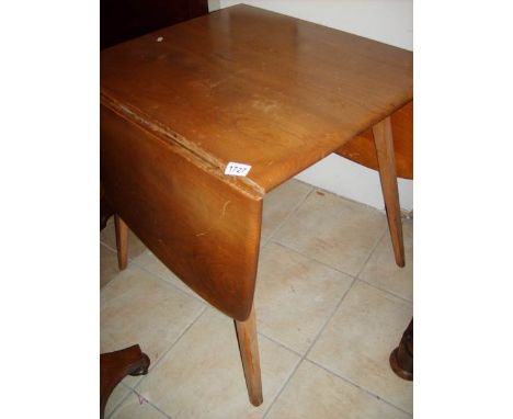 A light oak drop side Ercol style table