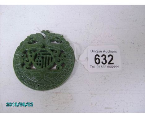 A carved jade medallion