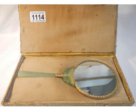 A cased jade hand mirror