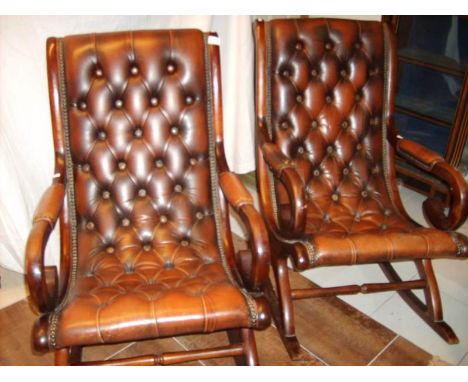 A pair of button back rocking chairs
