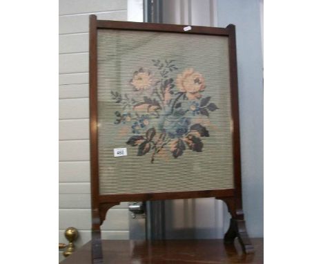 An Edwardian tapestry fire screen in mahogany frame