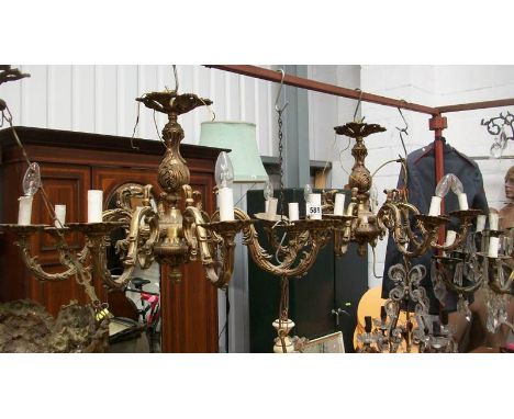 A pair of 8 lamp chandeliers