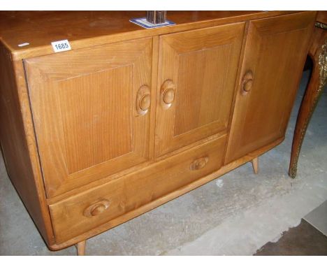 An Ercol light oak sideboard