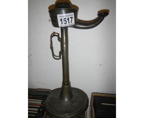 A pewter whale oil lamp