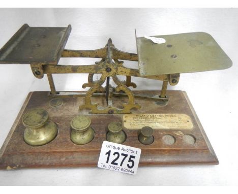 A set of wood and brass postal scales