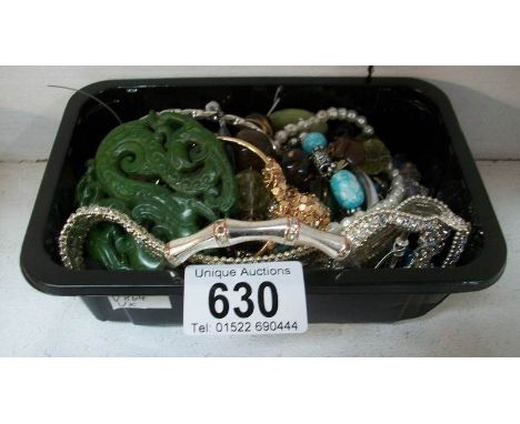 A box of costume jewellery including Jade item