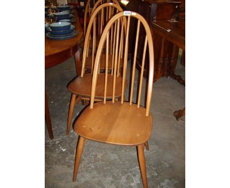 A set of 4 Ercol stick and hoop back chairs