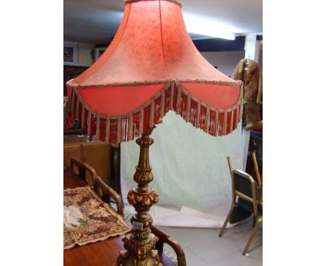 A large gilded table lamp