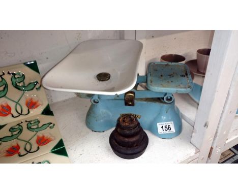 A set of cast iron 'Weylux' kitchen scales and weights