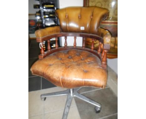 A button seat leather captain's chair