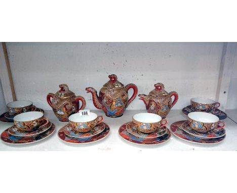 A 21 piece Oriental tea service (Geisha portrait) (1 spout a/f)