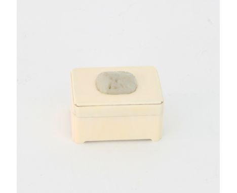 A Chinese ivory box,  circa 1920, the lid inset with a celadon jade plaque, 6cm 	
