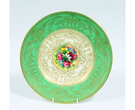 A Royal Worcester cabinet plate, the central floral panel painted by W H Austin with green and gilt border, 27cm diameter