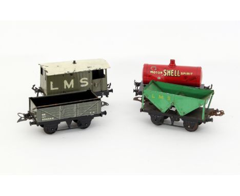 A Hornby Series 'O' gauge LMS brake van, a Meccano petrol tank wagon, a Hornby Series Wagon with sheet rail and a Hopper wagg