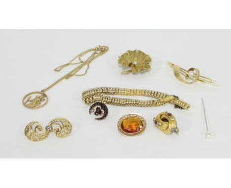 A collection of jewellery to include a Victorian gold, ruby and chrysoberyl scroll brooch (adapted from an earring); a modern