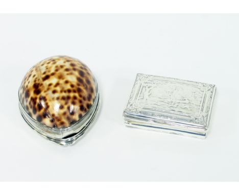 A Georgian cowrie shell box with white metal mounts, the cover crested, 9cm long and a white metal snuff box, the cover decor