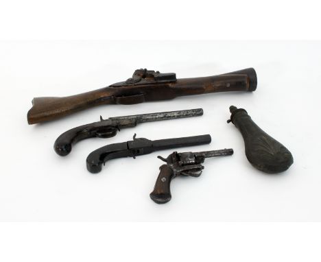A blunderbuss with beech wood stock, two 19th Century percussion cup pistols, a rimfire revolver and a powder flask