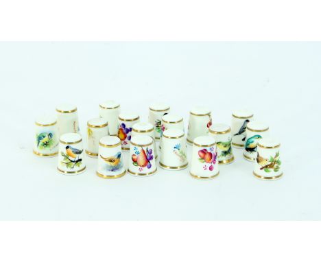 A collection of eighteen Royal Worcester thimbles painted fruit, birds etc, signed by M. Munslow and C Parker and others, and