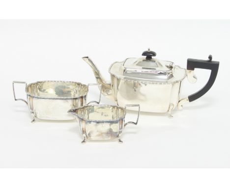 A silver three-piece tea set, WFM, Birmingham 1933, of rectangular form with reel moulded borders, approximately 960gm