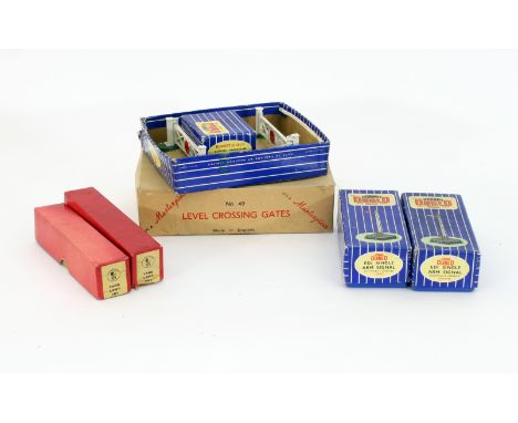 A quantity of Hornby Dublo three-rail accessories, EDI single arm signal (2), yard lamp (2), DI level crossing, buffer stops 