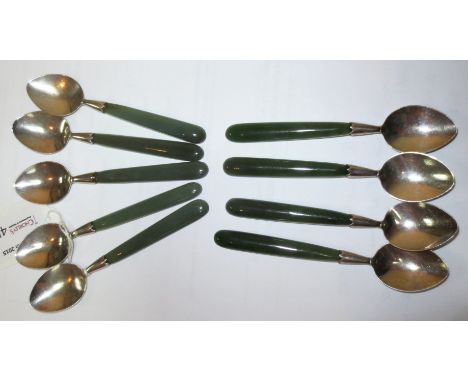 A set of nine silver tea spoons with New Zealand greenstone handles