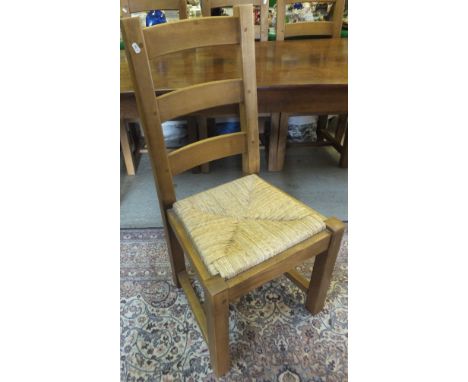 A set of six modern beech rush seated ladder back dining chairs
