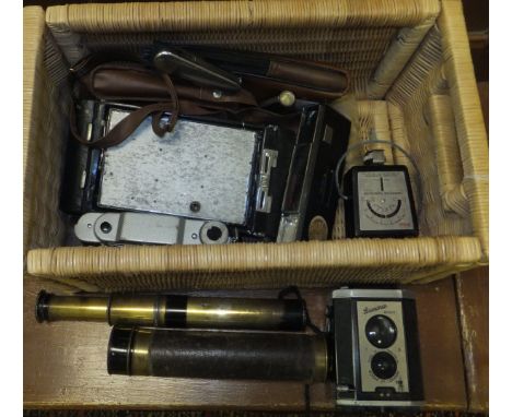 A Brownie Reflex camera, other assorted cameras, telescopes, lighters, etc