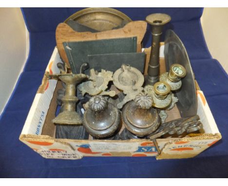 A box of various metal ware including three Hindu brass temple oil lamps, heavy bronze plaque of a Tyrolean couple, beetle do