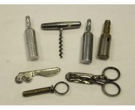 A collection of corkscrews to include a small bottle shaped folding corkscrew, the main body in the form of a bottle inscribe