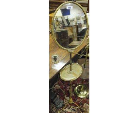 A Victorian painted iron and wooden shaving stand with adjustable mirror and twin sconces, raised on tripod base