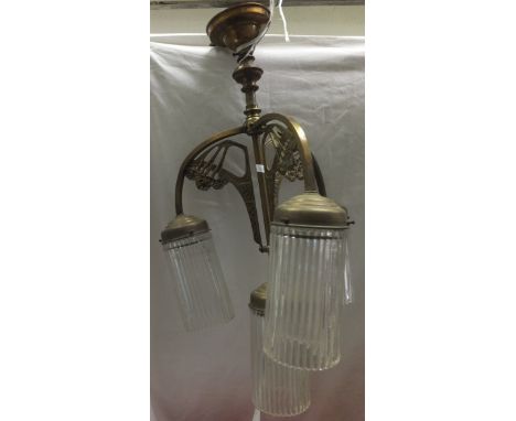 A Continental Art Nouveau design four light electrolier with ribbed glass shades