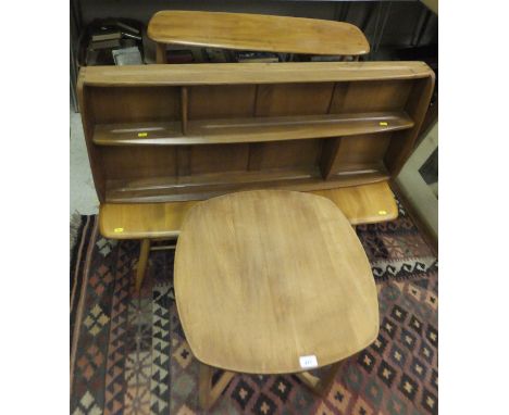 Four pieces of Ercol light elm furniture including a three tier wall mounted plate rack, square coffee table on chamfered sup