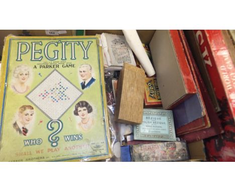 Assorted playing cards, dominoes, board games, etc plus a painted tin trunk, carpet and rush seated chair